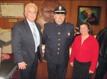 Paul Cotter (center) was promoted to sergeant in the Lynn Police Department. Police Chief Kevin Coppinger and Mayor Judith Flanagan Kennedy congratulated Cotter after the ceremony held at Lynn City Hall.