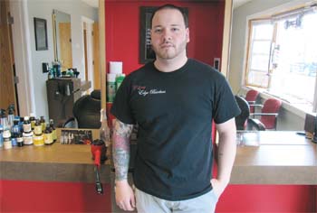 Angelo DiIorio is pictured inside Classy Edge Barbers, his new barbershop located at 13 Boston Street, Suite 2.