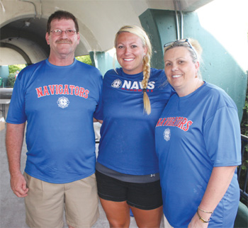 Ashley Laramie, assistant general manager of the North Shore Navigators, is pictured with her parents, Fred and Pam, before a recent game at Fraser Field.