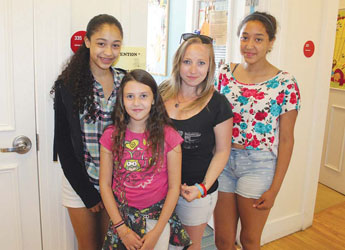 Girls Inc. media arts specialist Brittany Gorski, second from right, is pictured with students Destiny Garcia, Lydia Splaine, and Alana Espinosa at Girls Inc. headquarters In Lynn.