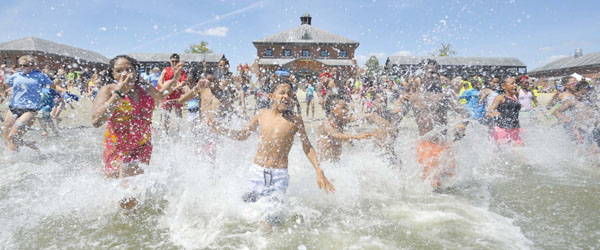 Area children beat the heat at Save the Harbor/Save the Bay’s 6th annual Youth Beach Bash & Splash at DCR’s Carson Beach.
